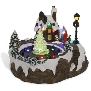 Musical luminous water fountain with Christmas village scene