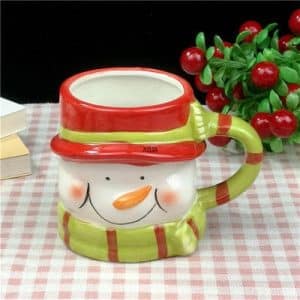 Mug in ceramic t te of snowman