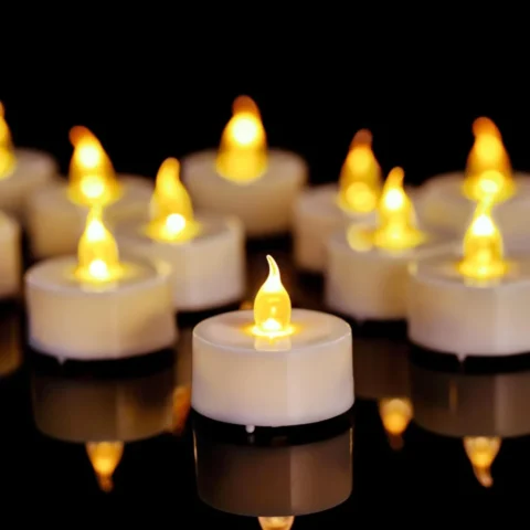 12 amber flickering LED tea lights with on/off switch, 3.7 cm