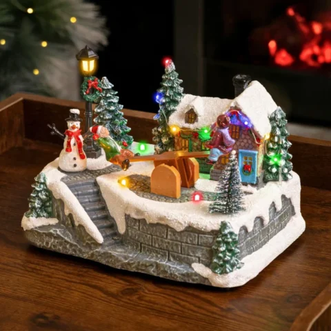 Animated see-saw Christmas village scene with 8 songs, 15 cm