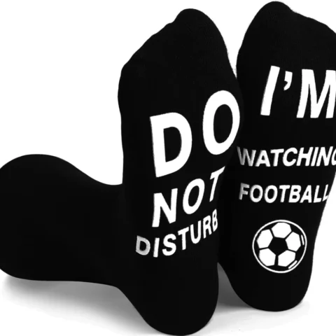 Football novelty socks with a funny message printed on the sole
