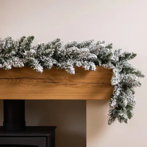 Snow-flocked spruce garland, 6 ft (180 cm), PVC, metal loops
