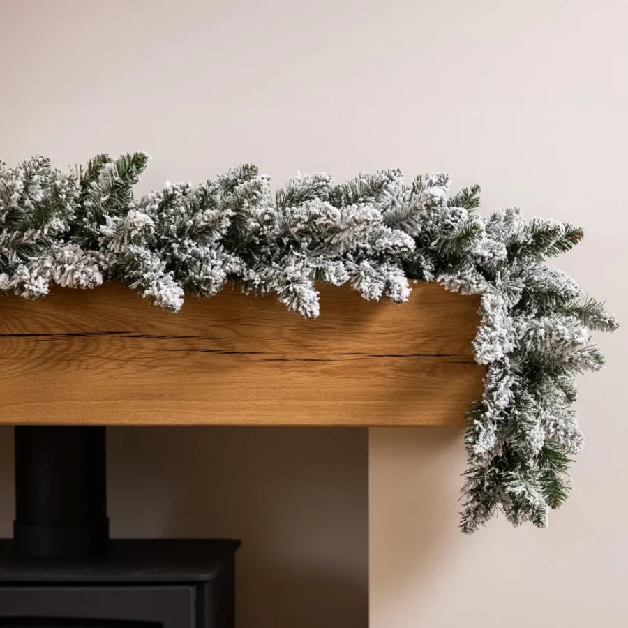 Snow-flocked spruce garland, 6 ft (180 cm), PVC, metal loops