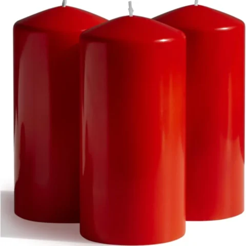 Three red cone-top pillar candles, 15 cm, unscented, dripless