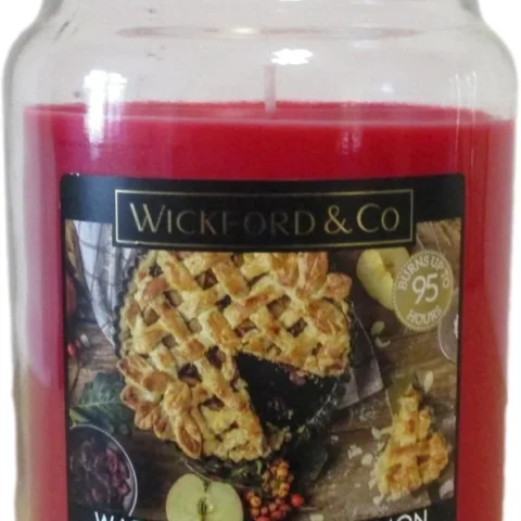 Warm apple and cinnamon scented candle in a lidded glass jar, 18 oz